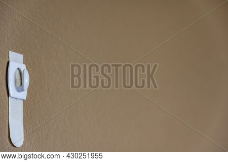 Selective Focus On Adhesive Strip Wall Hanger That Can Be Removed By Pulling Tape