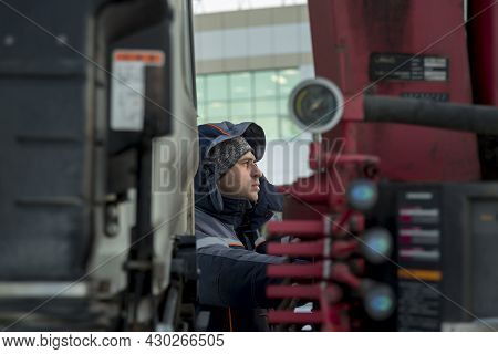 Portrait Of A Hydraulic Crane Operating Worker
