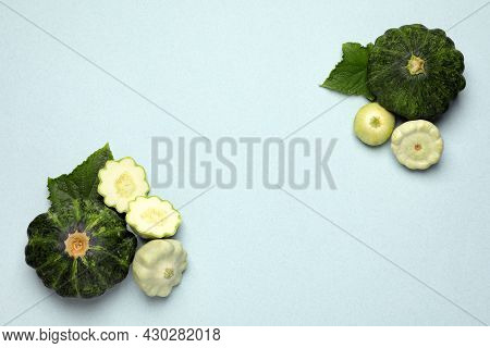 Fresh Ripe Pattypan Squashes With Leaves On Light Background, Flat Lay. Space For Text