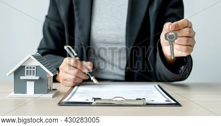 Agents Working In Real Estate Investment Hold The Key Ready Home Insurance Signing Contracts In Acco