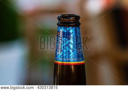 Romanian Timisoreana Beer Isolated, Close Up On Detail Of Glass Beer Bottle. Bucharest, Romania, 202
