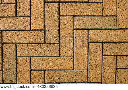 Close-up View Of Yellow Block Pavior Driveway. Seamless Texture Of Street Tiles. Pattern Of Sidewalk