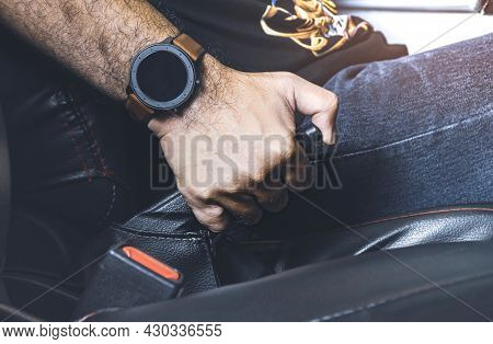Car Driver Pulling Handbrake Lever In The Car On The Parking