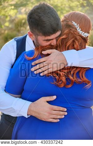 Turkish Man And His Beloved Caucasian Plus Size Red Headed Woman Embracing. Mixed Race Couple Hugs A
