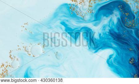 Abstract blue watercolor with gold glitter background