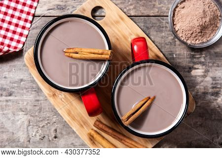 Traditional Mexican Chocolate Atole Drink On Wooden Table. Top View