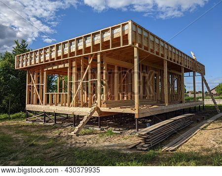 Construction Of A Timber Frame House. Frame Of A Private Residential Building With A Window And With