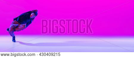 Flyer With Dancing Man, Break Dancer In Action, Motion In Modern Clothes Isolated Over Bright Magent