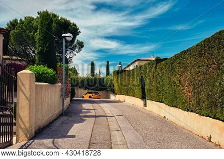 French town street view in town Aix-en-Provence with yellow car. Aix-en-Provence, France