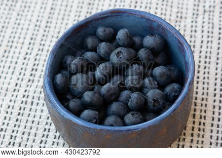 Fresh Farm Ripe Blueberries Berries In A Blue Ceramic Handmade Cup. Breakfast Mood. Copy Space. Vege