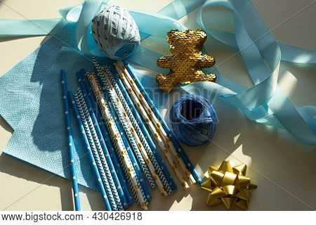 Baby Showers Decor. Blue And Golden Color Straws, Teddy Bear, Napkins, Ribbons For Gender Reveal Par