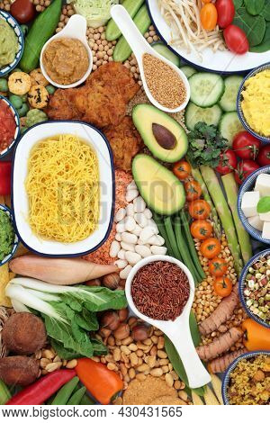 Vegan super food for a healthy life high in antioxidants, protein, omega 3, dietary fibre, anthocyanins, smart carbs, vitamins, minerals and  lycopene. Health care immune system boosting diet concept.