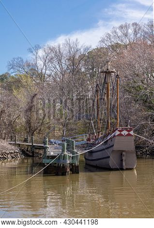 Jamestowne, Va, Usa - April 1, 2013: Historic Site. Old Sailboat Docked On Brownish Water Of Jamer R