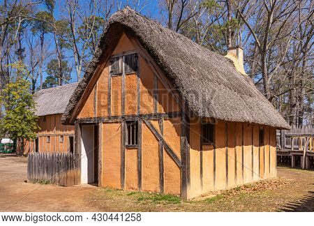 Jamestowne, Va, Usa - April 1, 2013: Historic Site. 1 Replica House Built On Side. Brown-orange Clay