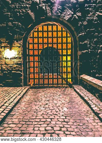 A Gateway Entrance To A Medieval Complex In Nyc During Night Time.