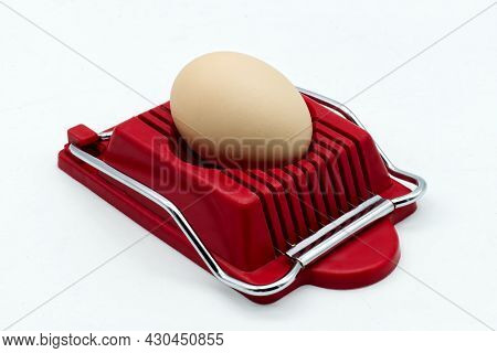 Household Device For Slicing Eggs. Hard-boiled Eggs Slicer Tool.