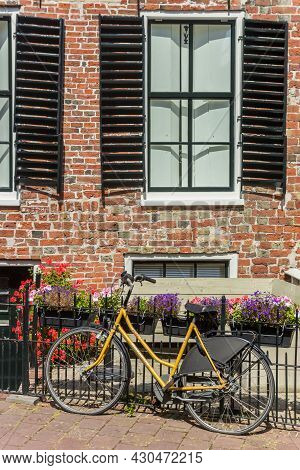 Appingedam, Netherlands - August 08, 2020: Bicycle In Front Of An Old House In Appingedam, Netherlan