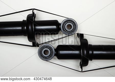 Two Silent Blocks On New Shock Absorbers, Parts For Car Repair. A Set Of Spare Parts For Servicing T
