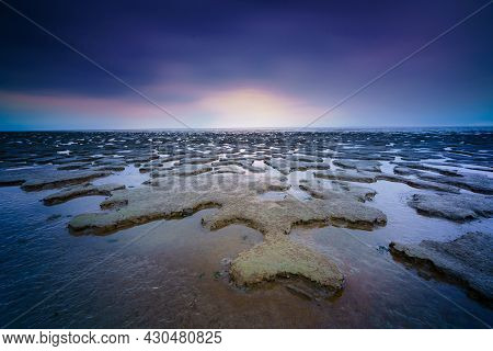 Panoramic View Over The Tidal Flats Along The Shore Of The Netherlands With Wadden Sea In Distance A