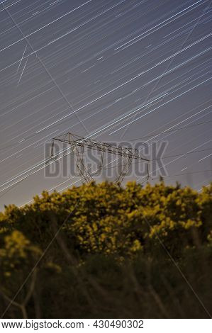 Beautiful Night View Of Falling Lyrid Meteors, Star Trails, Power Lines, Electric Transmission Pylon