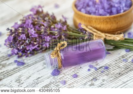 Lavender's Spa Products With Dried Lavender Flowers On A Wooden Table. Flat Lay Bath Salt And Massag