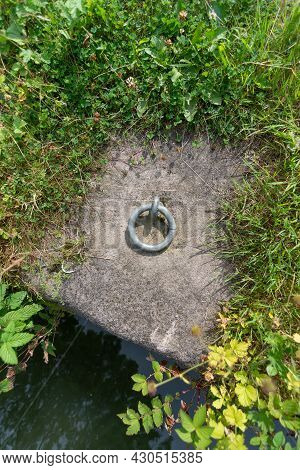 A Mooring Ring Attached To The Concrete Floor At The Side Of Cromford Canal In Derbyshire