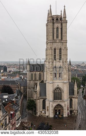 Gent, Flanders, Belgium - July 30, 2021: Closeup Of Tower Above Main Entrance Into Sint Baafs Cathed