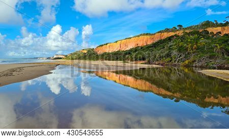 Arraial d'Ajuda is a district of the Brazilian municipality of Porto Seguro, on the coast of the state of Bahia, Cliff on Pitinga beach