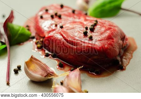 Raw Beef Sirloin Steak With Peppercorns And Garlic Prepared For Frying, Exclusive And Expensive Meat