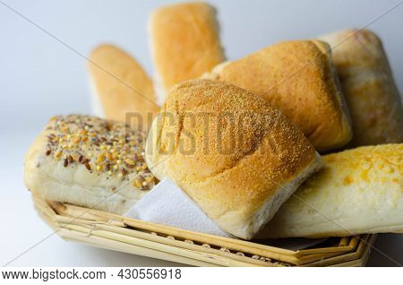Various Types Of Bread Served On A Wicker Tray, Delicious And Fresh Rolls