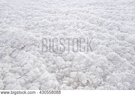 White Crystalline Salt Closeup Detail On Ein Bokek Beach At Dead Sea - World Most Hypersaline Lake