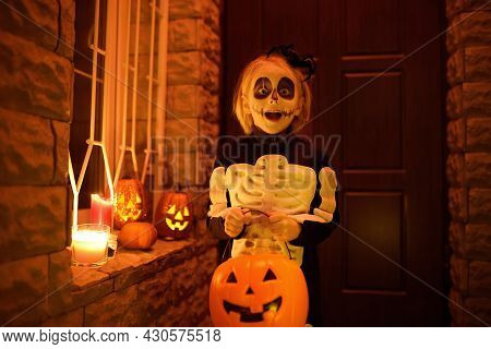 Little Child In Scary Skeleton Costume At Halloween Celebration Party. Baby Is Ready For Trick Or Tr
