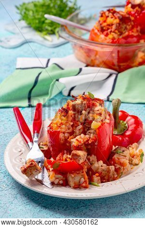 Stuffed Peppers With Tofu, Rice And Vegetables Are Served In A Plate With Tomato Sauce. Concept Is T