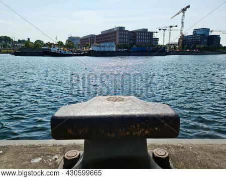 Different Bollards In Front Of The Water At The Port Of Kiel.