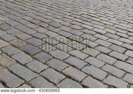 Abstract Background Of Old Cobblestone Pavement Close-up. Soft Focus.