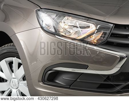 Novosibirsk, Russia - July 21, 2021: Lada Granta,  Close Up Of The Car Headlights. Exterior Closeup 