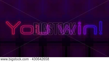 Image of image game screen with You win! text in flickering neon letters with multiple rows of abstract shapes moving in seamless loop. Retro image game concept digitally generated image.