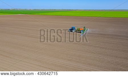 Above View, Overhead View On Tractor Until Spraying Big Endless Farmland Dragging Mounted Wide Agric