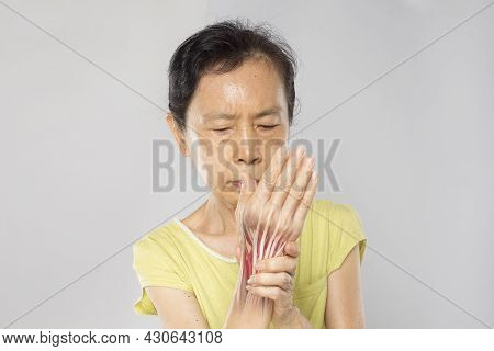 Old Asian Woman Feel Wrist Muscle Pain