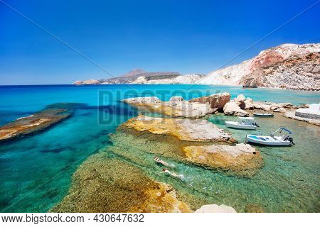 Idyllic Fyriplaka beach surrounded by beautiful cliffs on Greek island of Milos