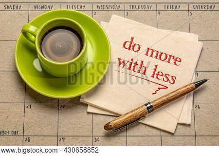 do more with less motivational note on napkin with a cup of coffee, productivity, smart work, business, education and personal development concept