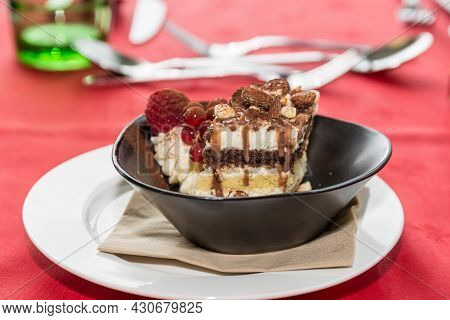 Creamy Tiramisu With Fruits And Nuts As A Delicious Dessert