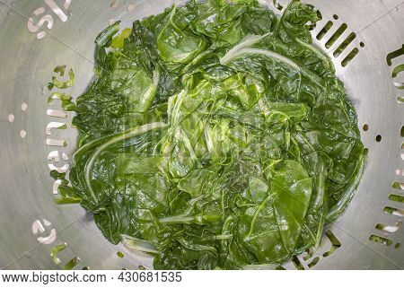Boiled Spinach On Colander. Selective Focus Shot
