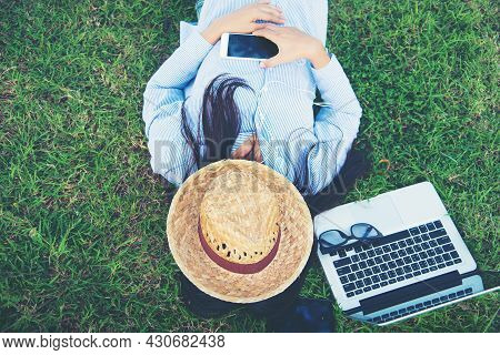 Woman Lay Down Sleep On Green Grass Meadow Garden Summer Sunshine Day Happy Time Outside. Hipster Fr