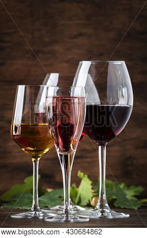 Wine Tasting. Red, White, Rose And Champagne - Still And Sparkling Wines Sin Glasses On Vintage Wood