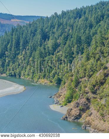 The Rogue River Flowing Through The Siskiyou National Forest In Oregon