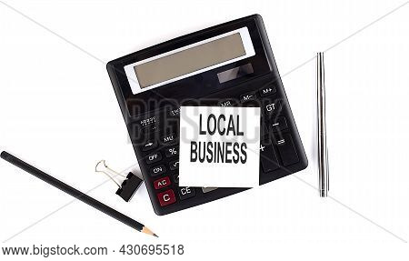Local Business Text On Sticker On Calculator With Pen,pencil On White Background