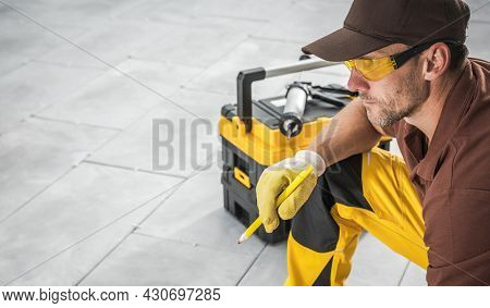 Caucasian Professional Residential And Commercial Patio Designer In His 40s With Pen And His Tools O