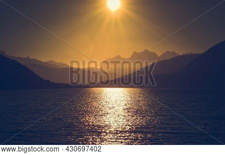 Scenic Northern Norway Nordland County Sunset With Ocean Bay And Mountains Range. Summer Time In The