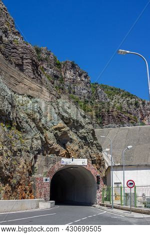 Koman Lake, Albania - August 10, 2020: View Of Tunnel In Mountain - Entrance To Koman Lake - Water R